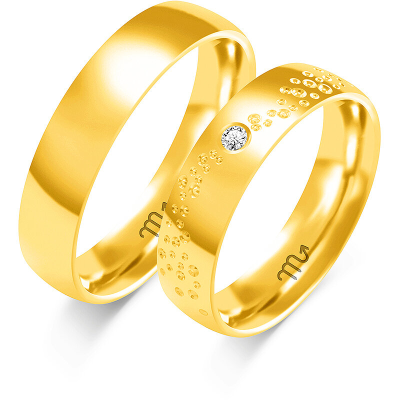 Alianças de casamento brilhantes com anéis e pedras