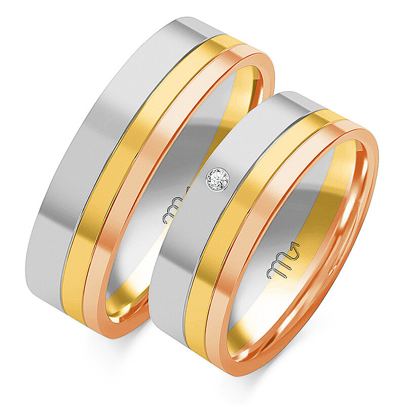 Anéis multicoloridos de casamento brilhantes com uma pedra
