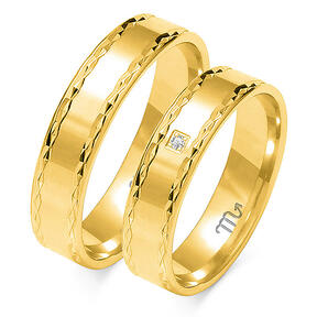 Engraved shiny wedding rings with a stone