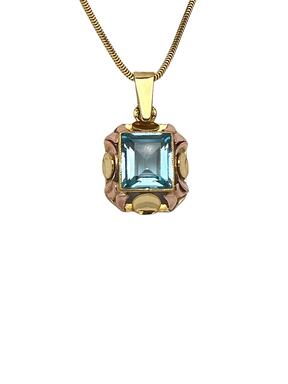 Gold pendant with blue zircon