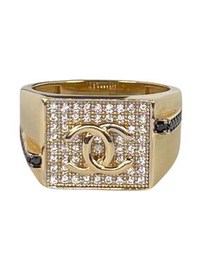 Gold ring with logo and zircons