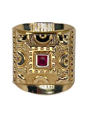 Gold ring with red zircon