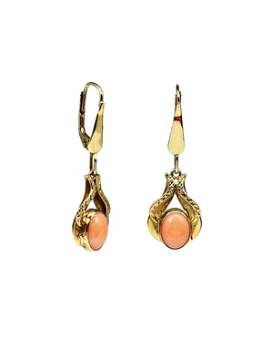 Golden dangling earrings with an orange sunstone
