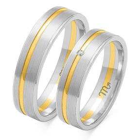 Matte wedding rings with a shiny line with a stone