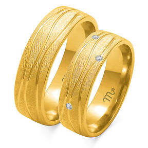 Multi-colored wedding rings engraved with lines and rhinestones