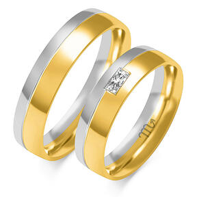 Shiny wedding bands with waves and stones