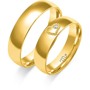 Shiny wedding rings with a heart and a stone