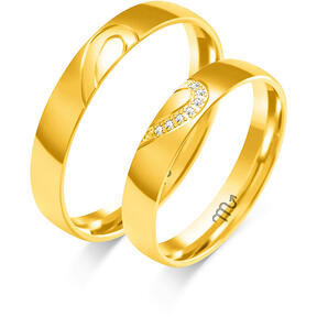 Shiny wedding rings with heart engraving