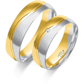 Shiny wedding rings with stones and waves