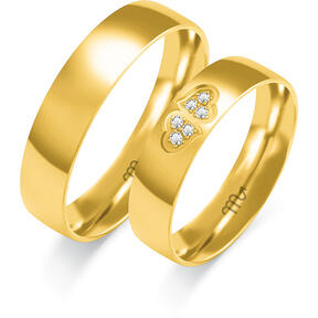 Shiny wedding rings with two hearts