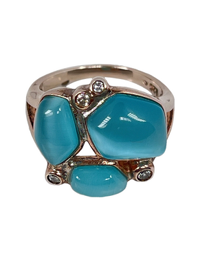 Silver ring with surface treatment and blue stones