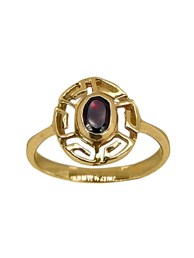 Spīdīgs zelta gredzens ar sarkanu cirkonu