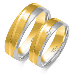Wedding rings with decorative lines and stones