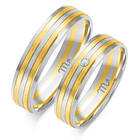 Wedding rings with frosted lines and a stone
