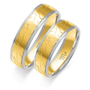 Wedding rings with glossy leaves