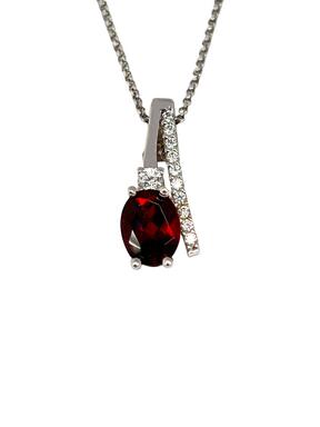 White gold pendant with red zircon